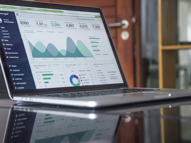 A laptop open on an analytics dashboard showing traffic over time